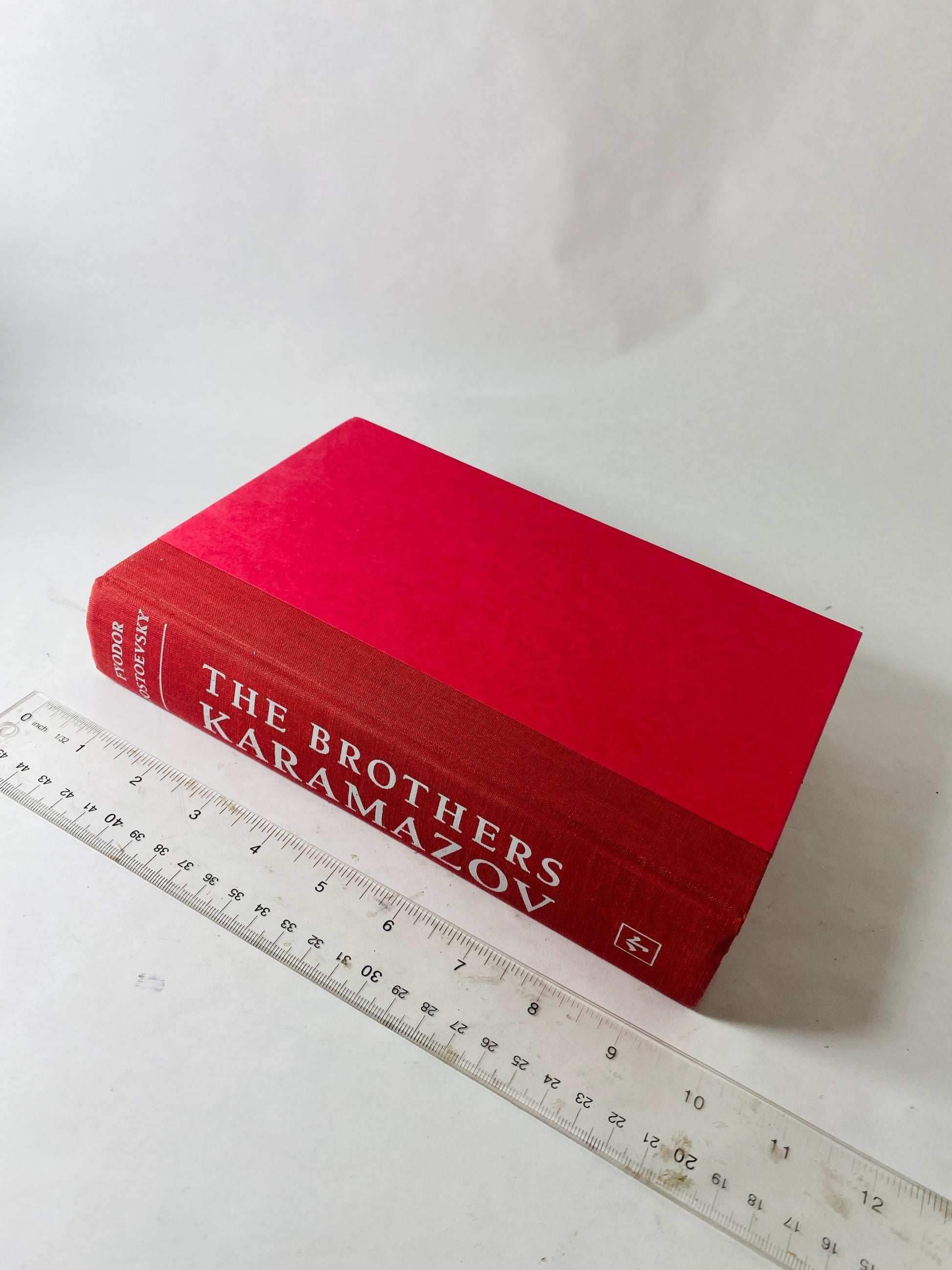 Brothers Karamazov by Fyodor Dostoevsky Vintage red leatherette book circa 1989. Examines ethics of God and free will. Rafael Palacios