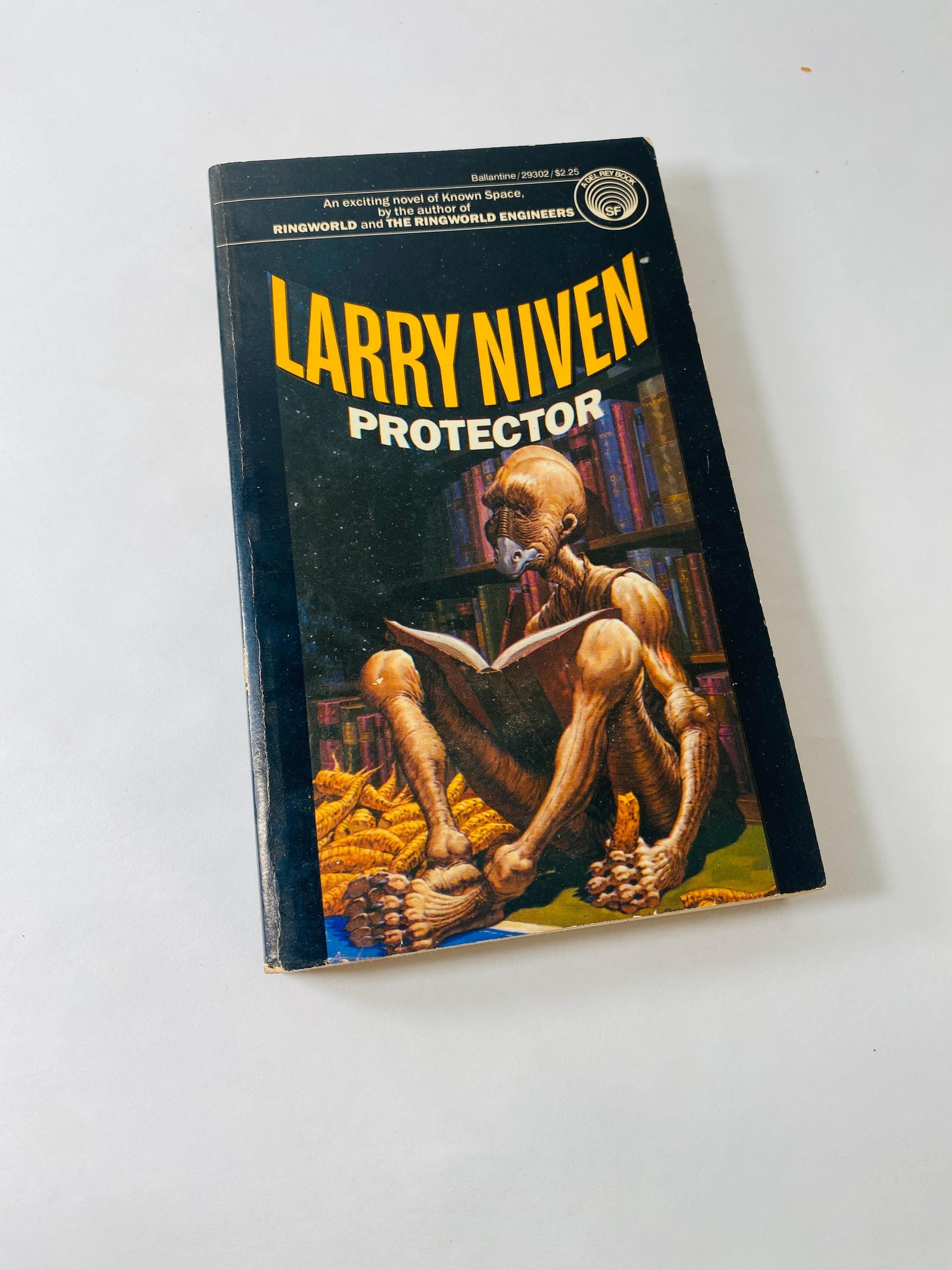 Protector vintage paperback book by Larry Niven circa 1981 about space warefare and saga of Brennan the Belter and Phssthpok the Pak scifi