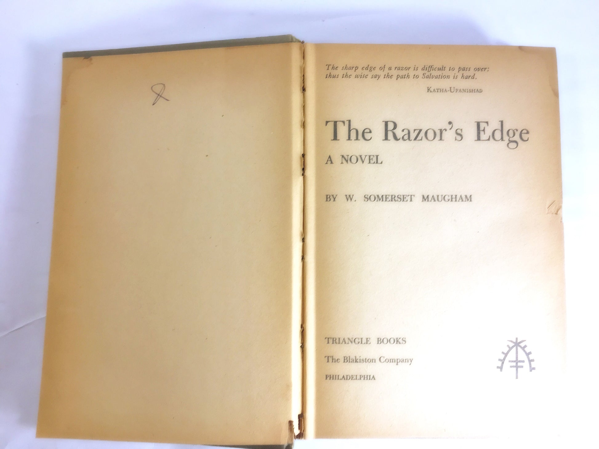 1944 Razor's Edge by W Somerset Maugham Vintage book about a World War I fighter pilot who searches for meaning. White bookshelf decor