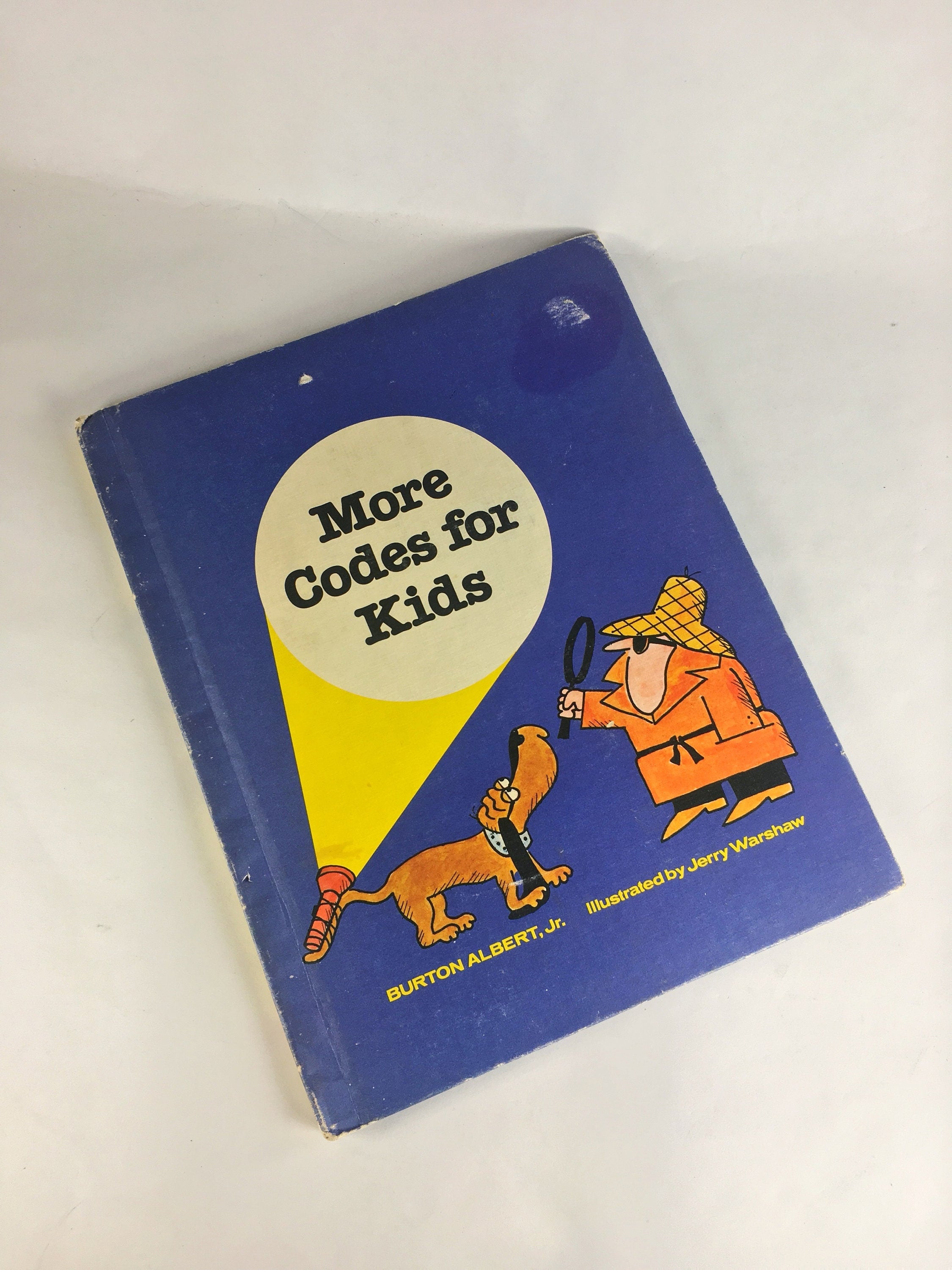 Codes for Kids. Vintage book by Burton Albert circa 1979 about encoding secret messages through code wheels inks languages. Weekly Reader