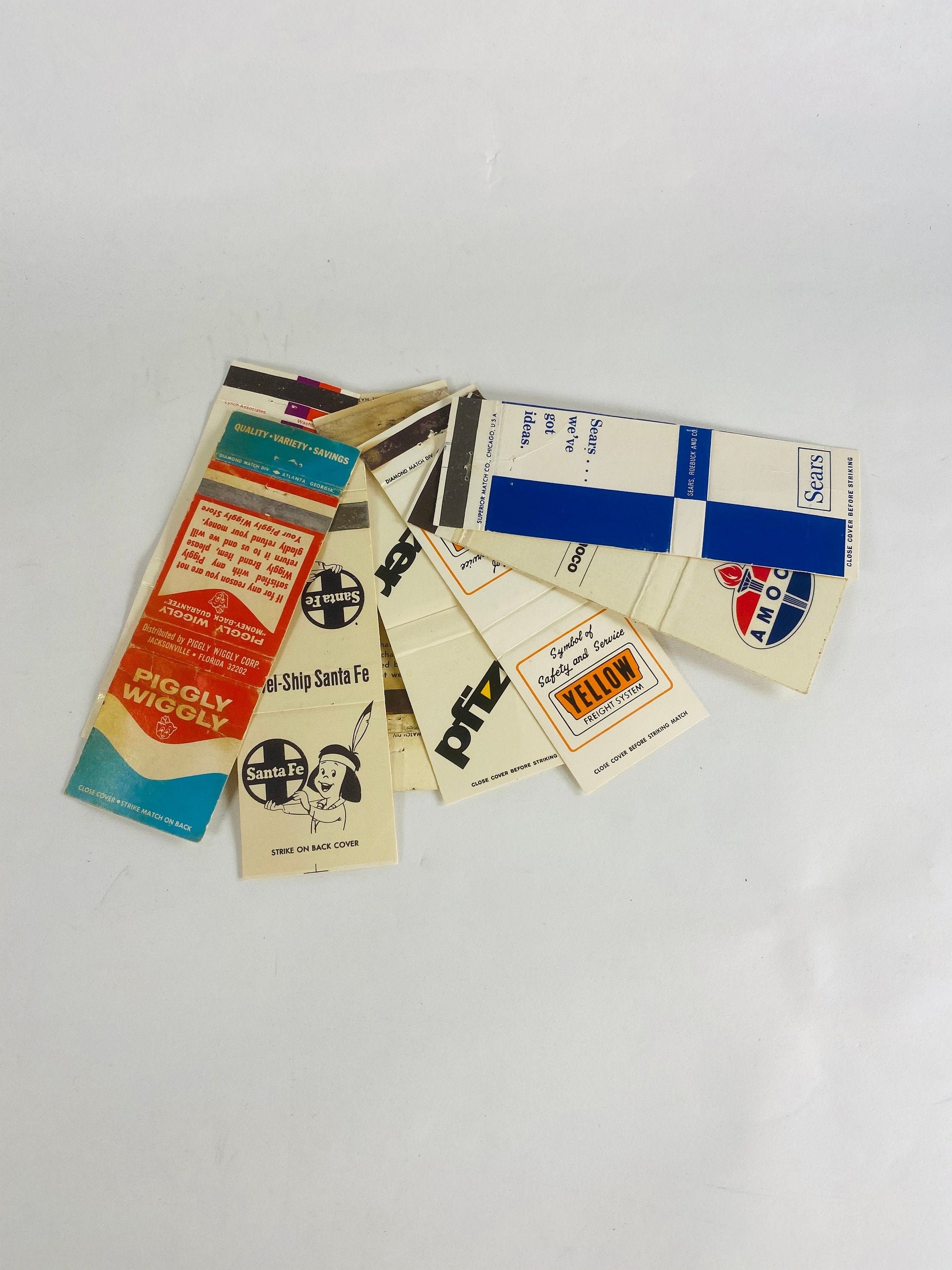 Army & Airforce Exchange Amoco Piggly Wiggly Pfizer Sears Vintage Matchbook cover lot Yellow Freight Auto-Train Merchant advertising