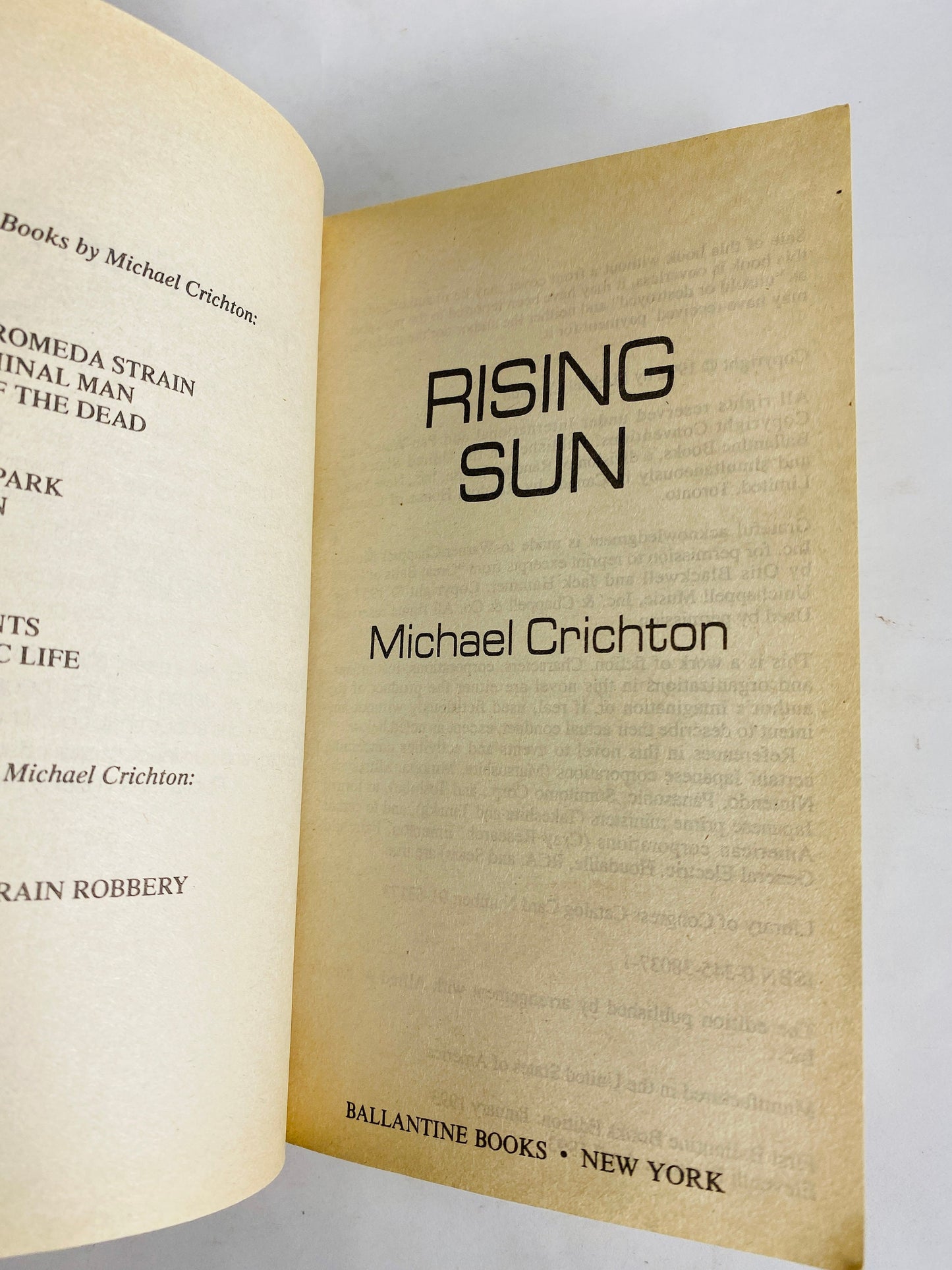 Rising Sun by Michael Crichton vintage paperback book circa 1992 set in Japan where business moguls compete for electronics industry