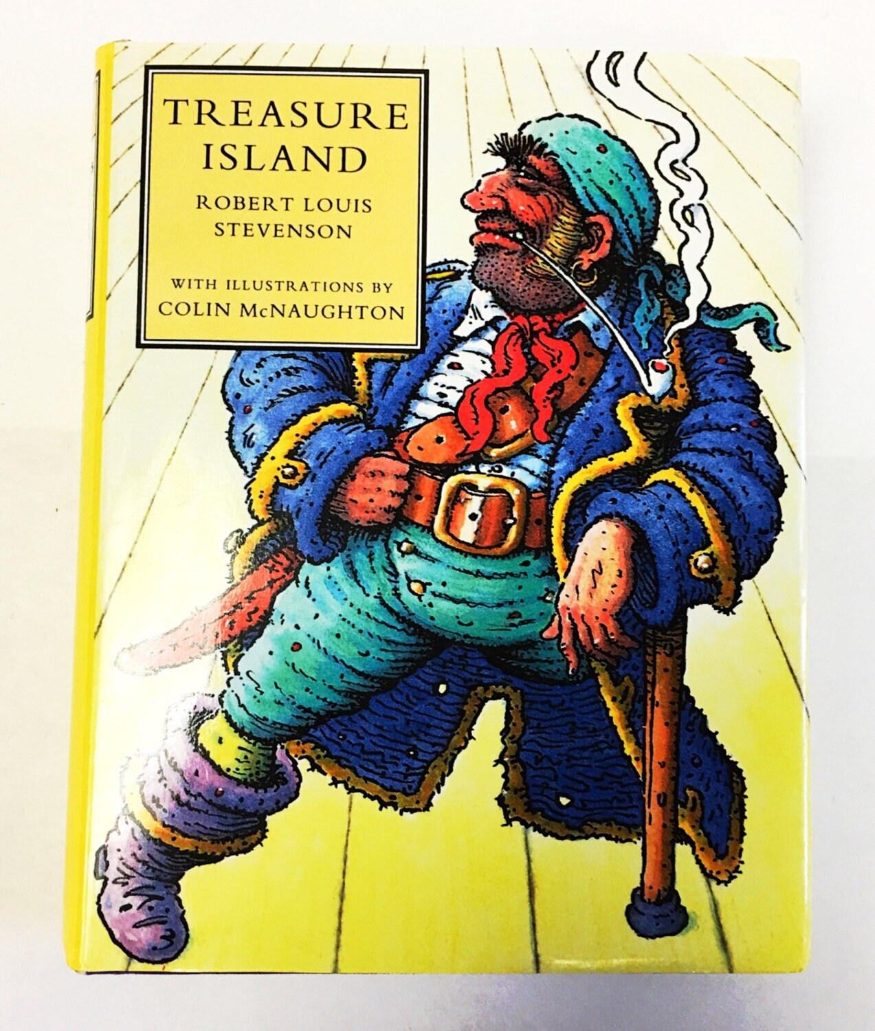Vintage Treasure Island book by Robert Louis Stevenson. Coming-of-age story. Long John Silver. Pirates fiction