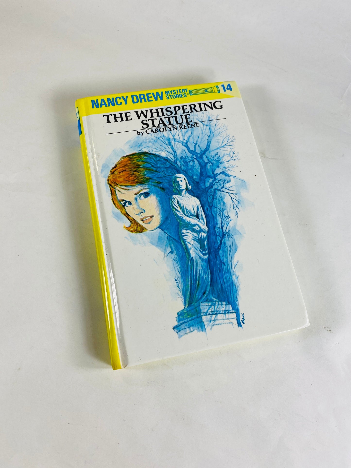 Nancy Drew Mystery Stories vintage book in good condition by Carolyn Keene Whispering Statue Glossy yellow spine hardcover volume 14