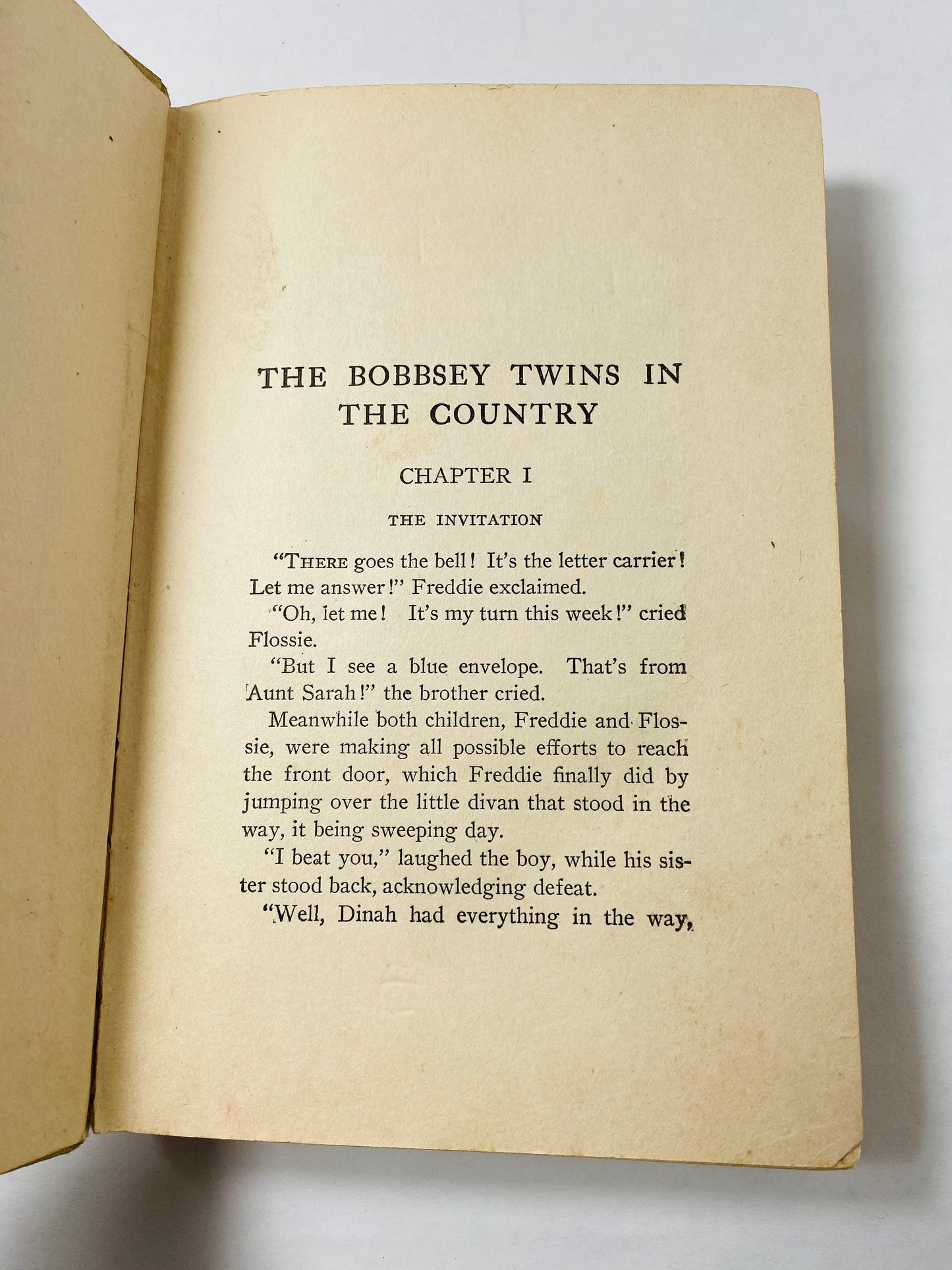 Bobbsey Twins in the Country vintage book circa 1922 by Laura Lee Hope. Antique beige white collectible. Poor Condition