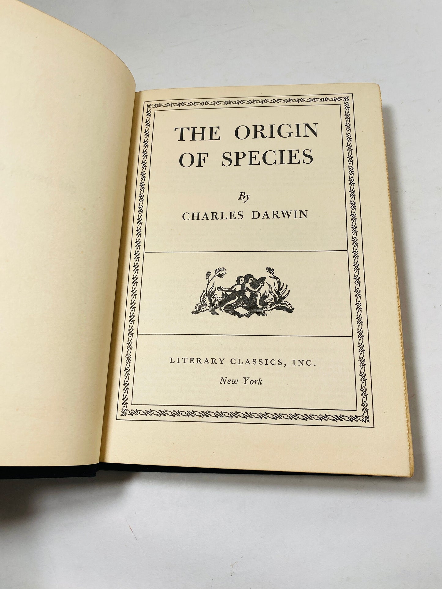 Origin of Species vintage book by Charles Darwin Black and silver decor circa 1945